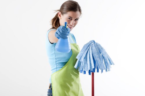 Carpet cleaner preparing equipment safely before starting work
